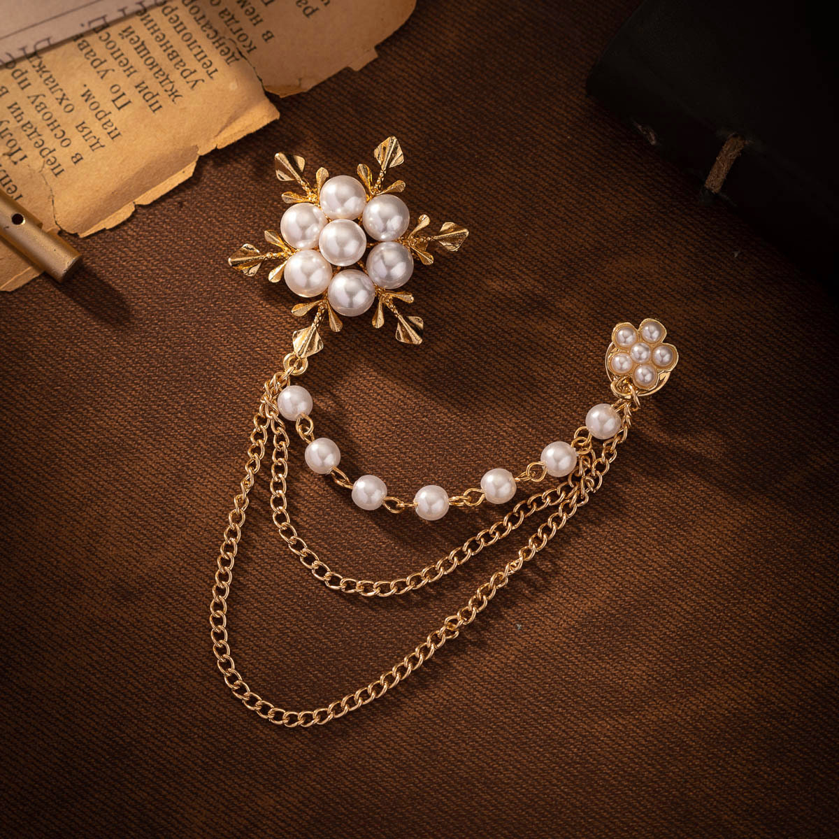 minimalist pearl snowflake brooch